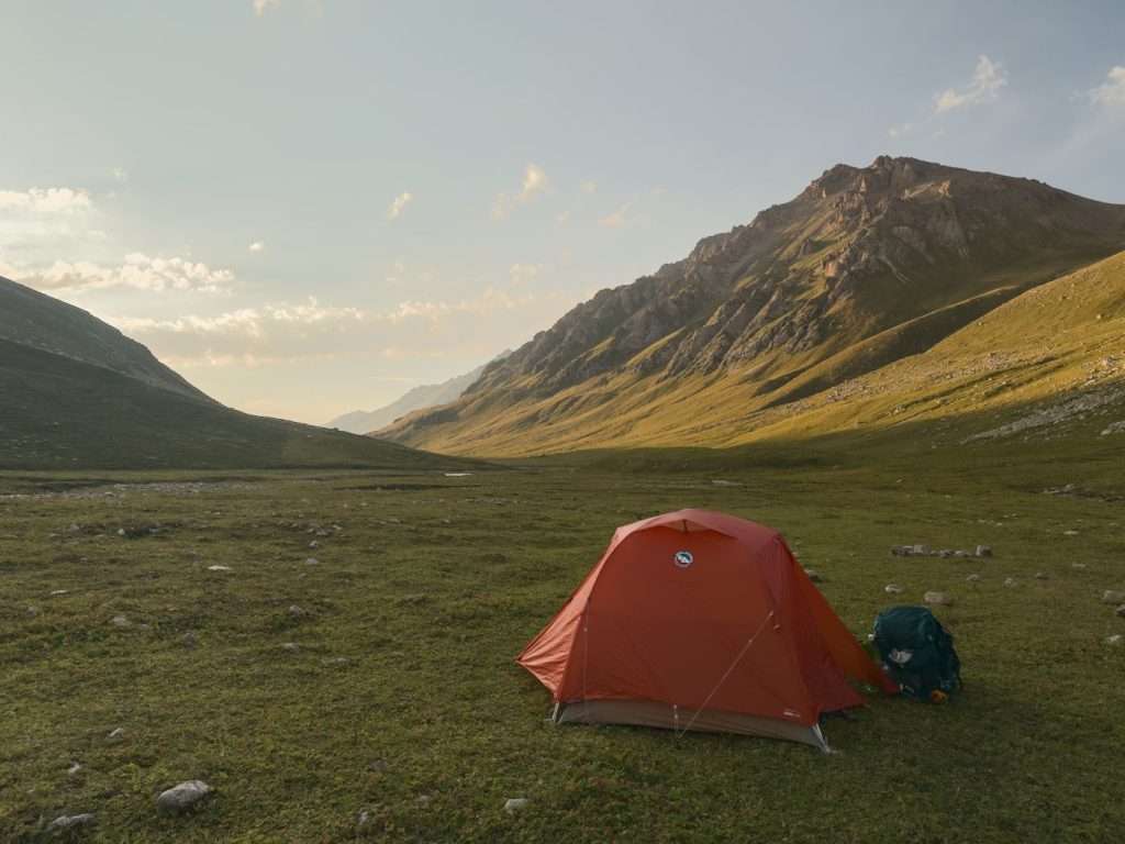 A photo of an orange backpacking tent in Jergez Valley